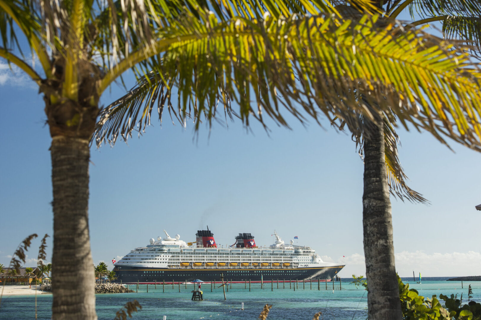 A cruise ship is docked in the ocean.