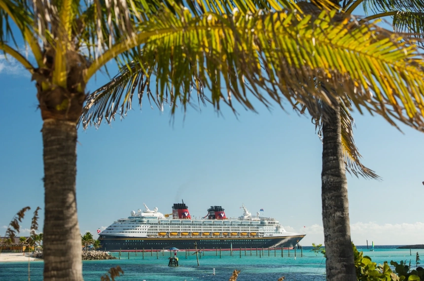 A cruise ship is docked in the ocean.