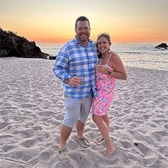 A man and woman standing on the beach